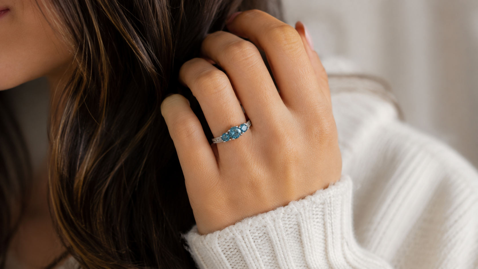 blue solitaire engagement ring