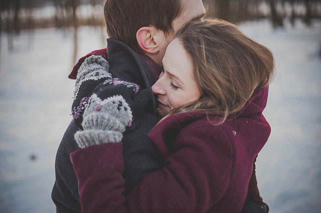 couple hugging in snow