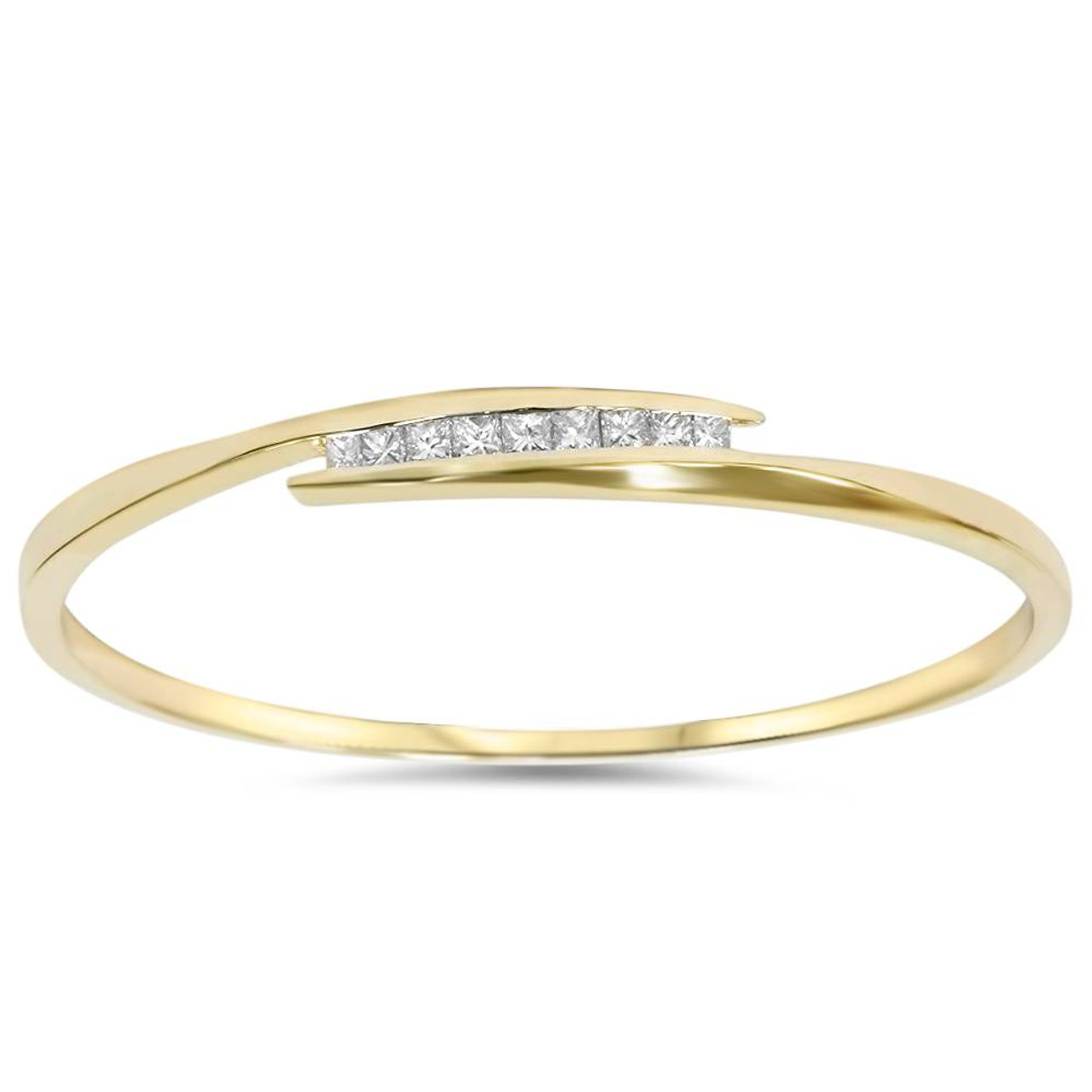 a gold bangle bracelet with diamonds