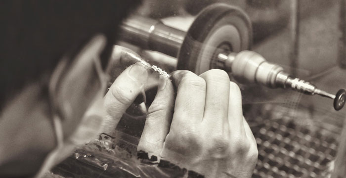 jeweler buffing a custom ring