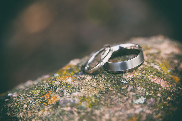 matching wedding rings on a large stone