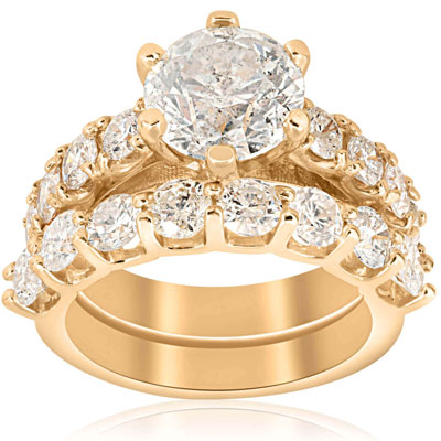 six prong gold engagement ring and wedding band set