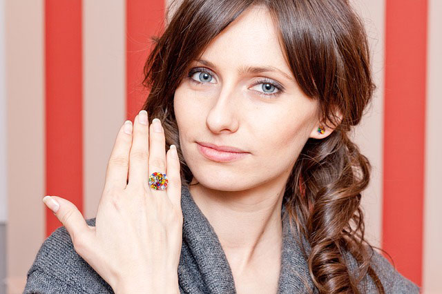 woman sporting multi-colored ring