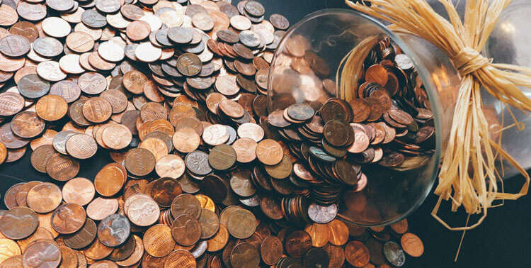 pennies spilling from a jar