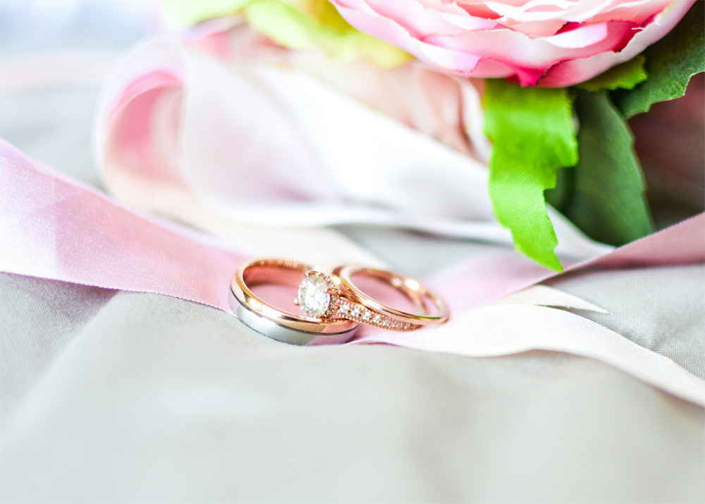 rose gold and silver rings on pink ribbon